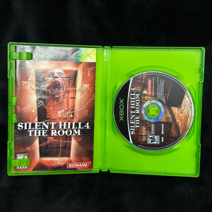 Xbox game disc and case titled 'Silent Hill: The Room' on a black background