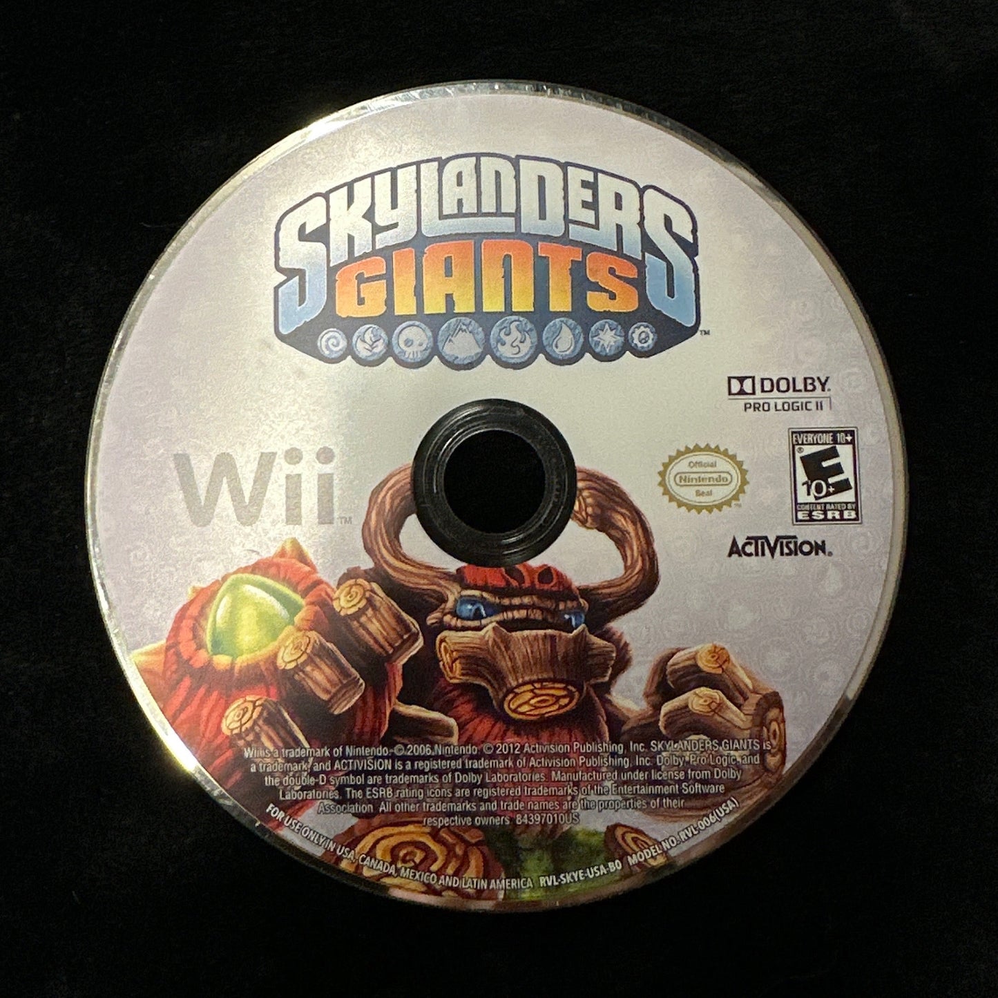 A Skylanders Giants Wii game disc resting on a black fabric surface, with the Skylanders Giants logo, Wii branding, and Activision branding visible on the disc.