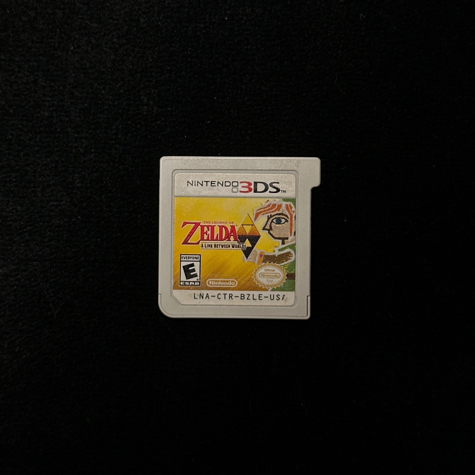 Nintendo 3DS game card with 'The Legend of Zelda' logo on a black background
