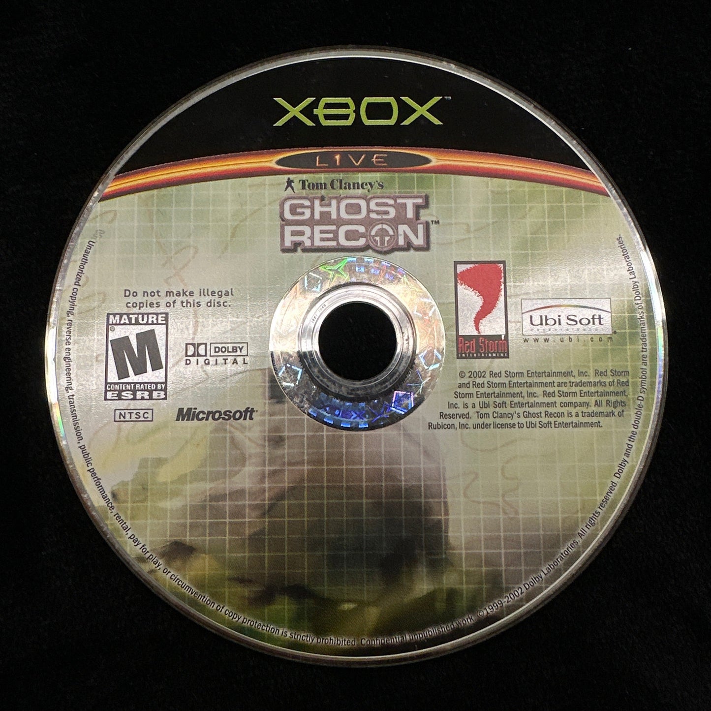 Game disc for 'Tom Clancy's Ghost Recon' on an Xbox console with a black background