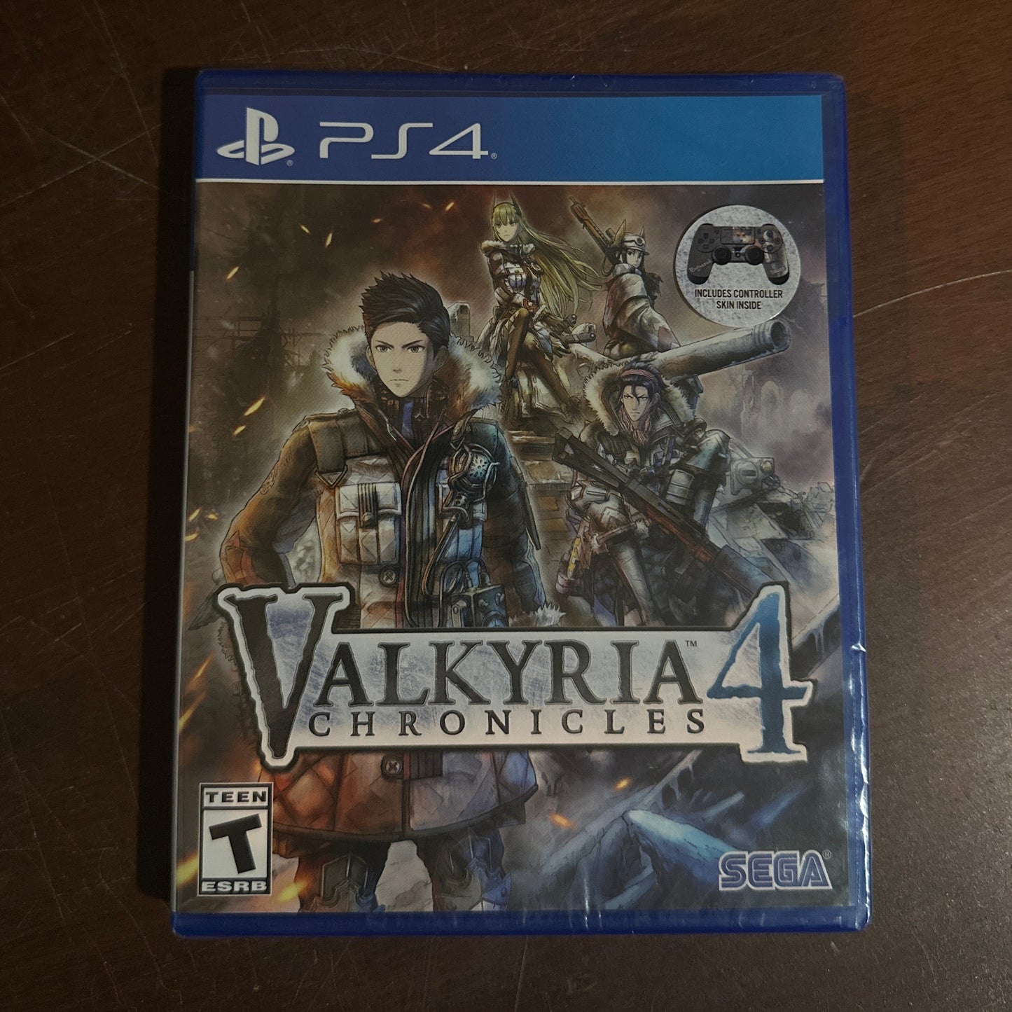 Valkyria Chronicles 4 game case for PS4 on a wooden surface