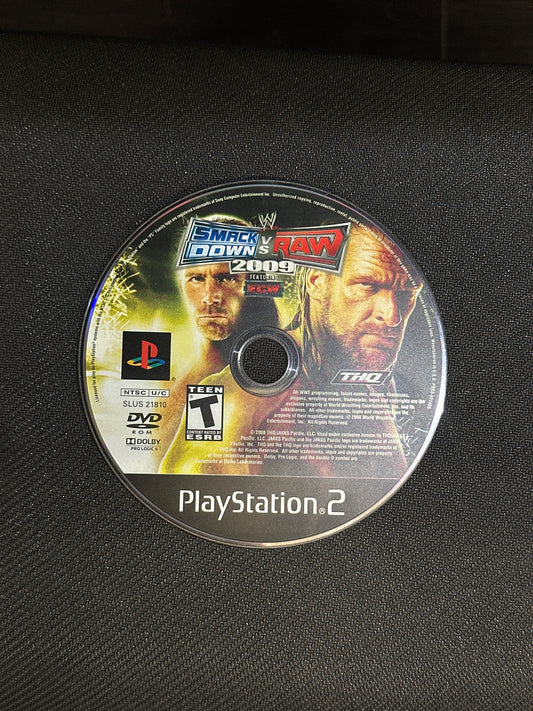 PlayStation 2 game disc on a black textured surface