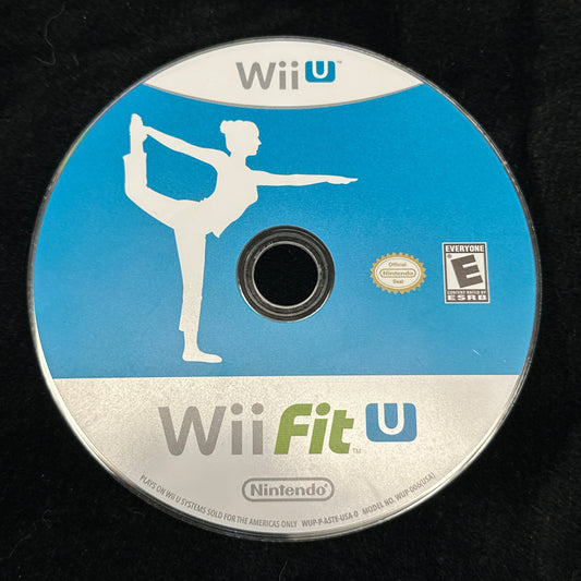 Wii Fit U game disc on a black background