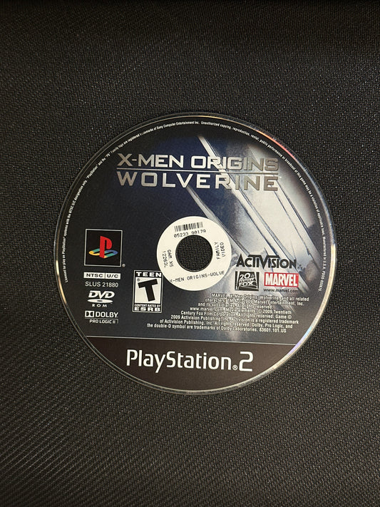 PlayStation 2 game disc for 'X-Men Origins: Wolverine' on a textured black surface
